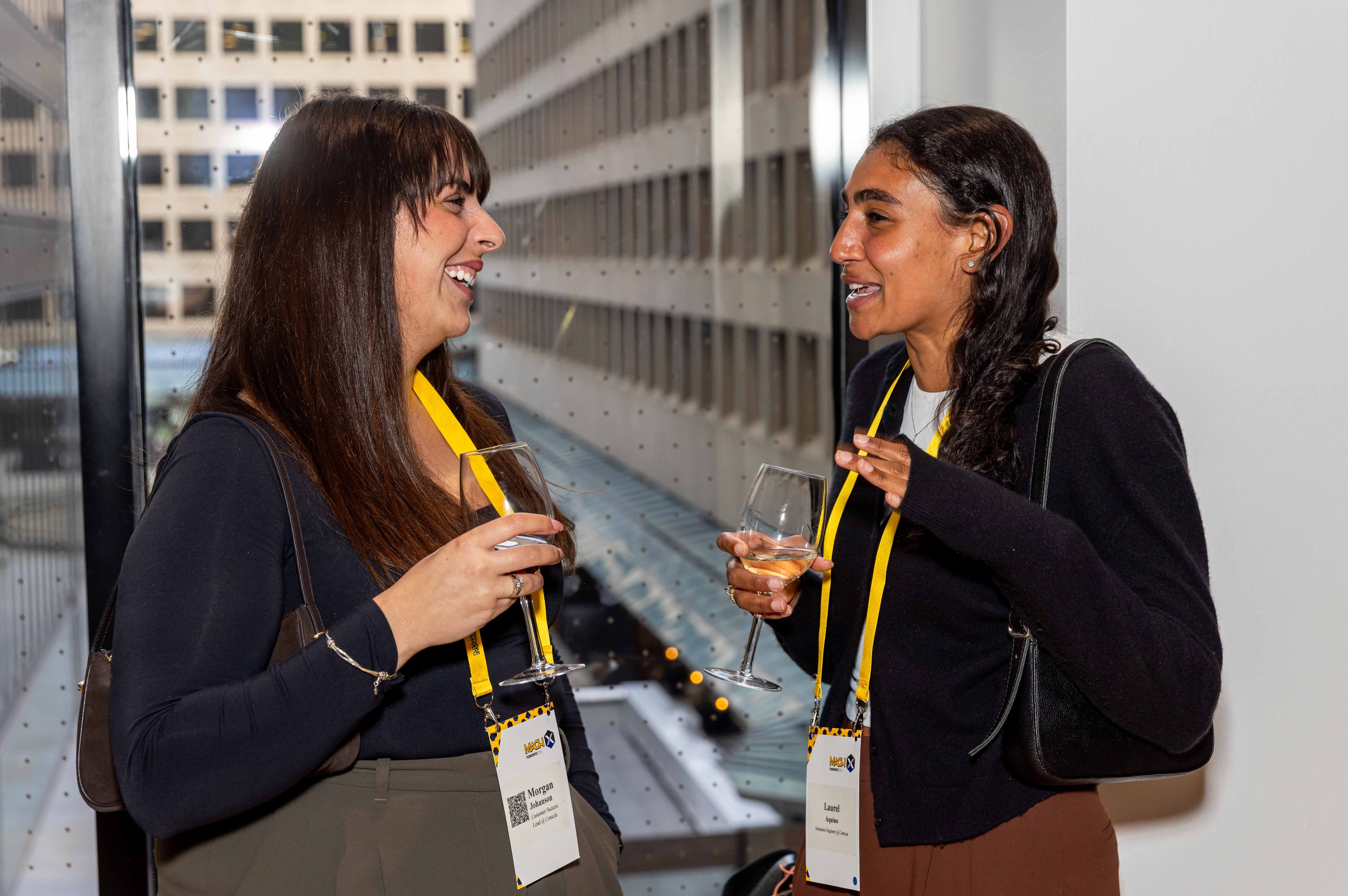 Two Women Chatting At A Networking Event